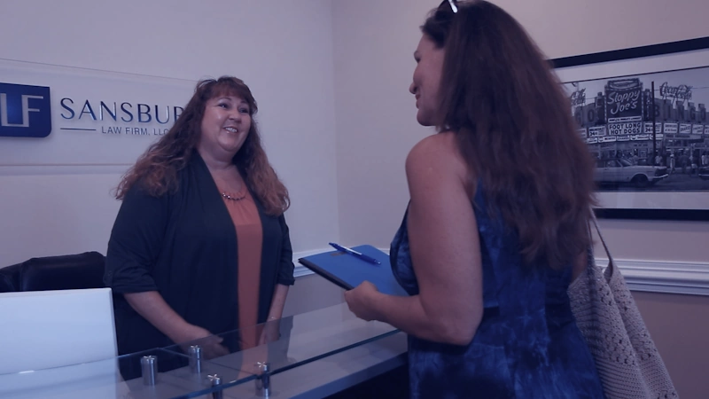 A personal injury lawyer myrtle beach talks with a client in a reception area